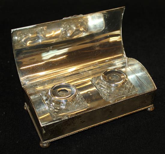 A silver ink stand